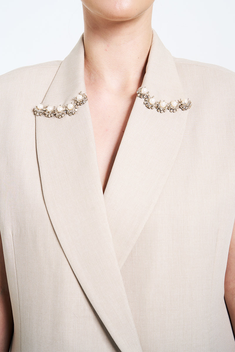 Cream Aidan & Ice Caleste blazer shown on a hanger, featuring a tailored fit and classic lapel design.