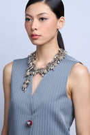 Aidan & Ice Neilla Silver Necklace featuring a delicate chain and elegant pendant on a neutral background.