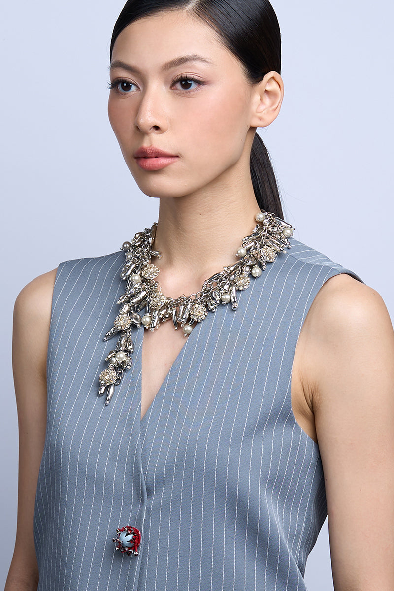 Aidan & Ice Neilla Silver Necklace featuring a delicate chain and elegant pendant on a neutral background.