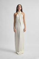 Deme by Gabriella CULT MIA X Deme maxi dress featuring flowing fabric and floral pattern, stylishly displayed on a hanger.