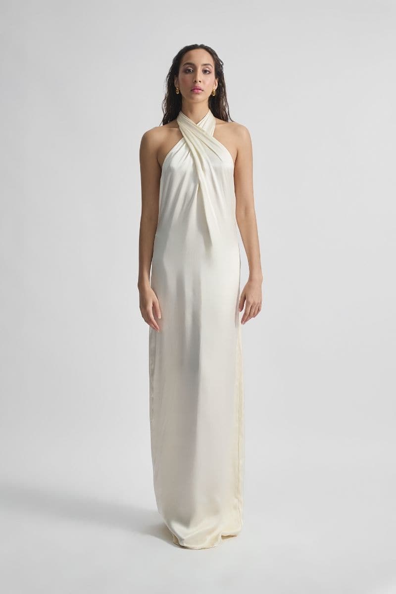 Deme by Gabriella CULT MIA X Deme maxi dress featuring flowing fabric and floral pattern, stylishly displayed on a hanger.