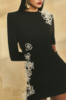 L'SCARLETT long-sleeve poly crepe mini dress shown in black, featuring a fitted silhouette and round neckline.