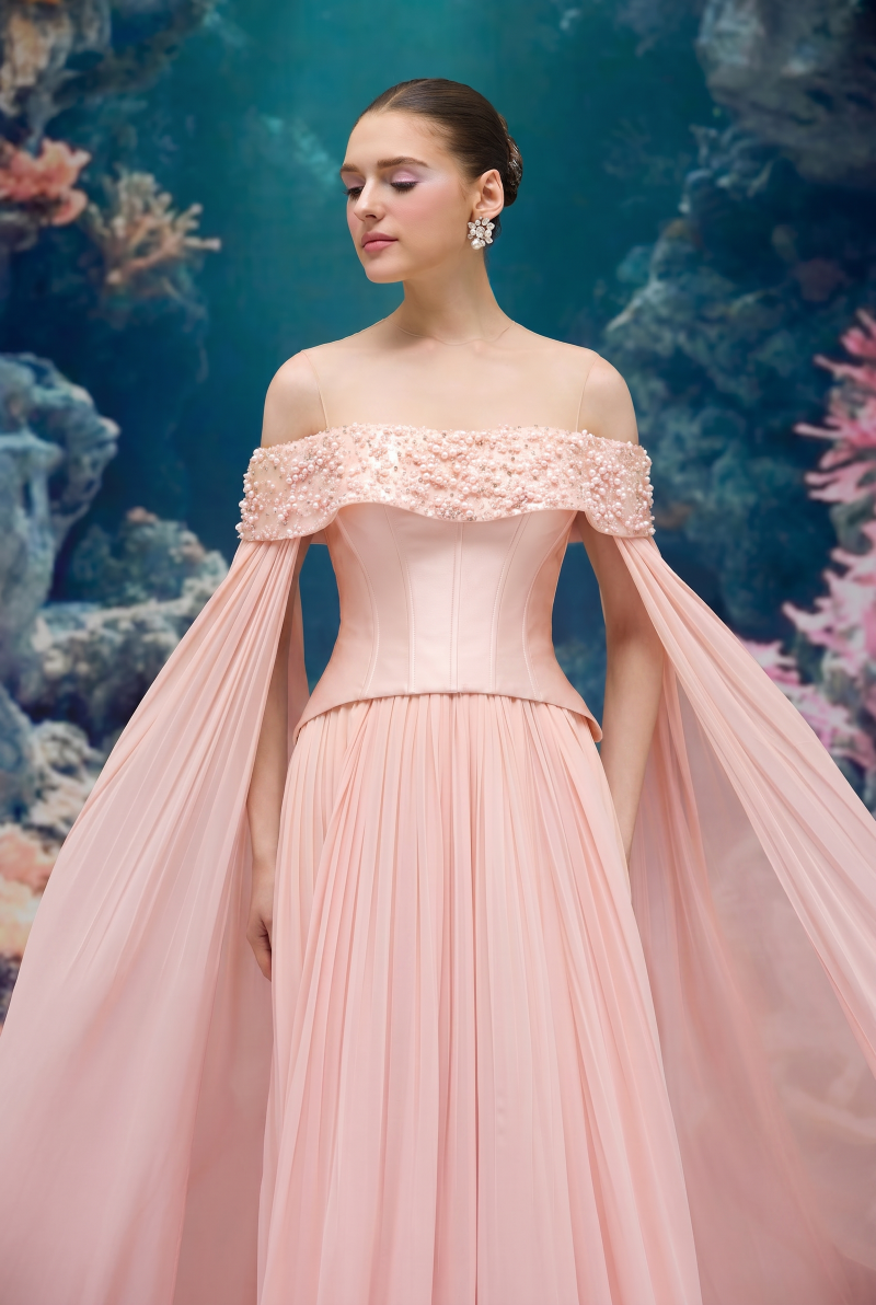 Light pink ISABEAU Royal taffeta and chiffon gown by 21Six, featuring elegant draping and intricate fabric details.