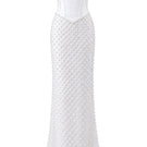 Elegant ivory Camellia Pearl corset gown by HACCHIC COUTURE, featuring intricate pearl detailing and a flowing gown silhouette.