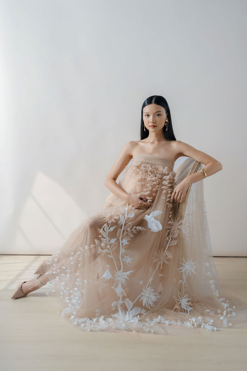 Elegant NUDE 3D-floral tulle maxi dress by DOC BAN, featuring intricate floral detailing and flowing fabric.