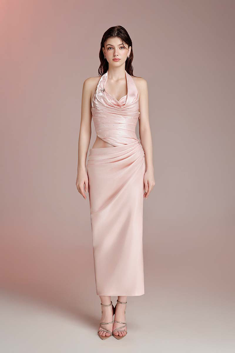 Do Long Ember Trail pink gown with flowing fabric and delicate details, perfect for elegant occasions.