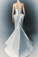 White Plan Christopher dress gown with elegant design, featuring flowing fabric and sophisticated style ideal for special occasions.