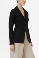 Dāl the Label modal rib knit collared cardigan with long sleeves and button closure, displayed on a neutral background.