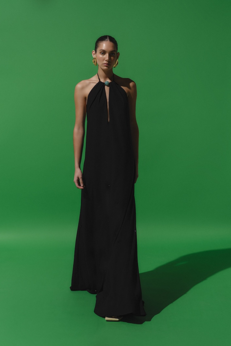 Black Baobab Rondine maxi dress featuring a flowing silhouette and elegant design, perfect for stylish occasions.
