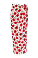 White Poppy pareo cover-up by Verdelimon featuring lightweight fabric and floral design, styled as a beach or poolside wrap.