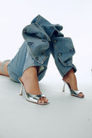 Kolane Greta silver mule sandals with open toe and block heel, stylish and comfortable footwear for casual or dressy occasions.