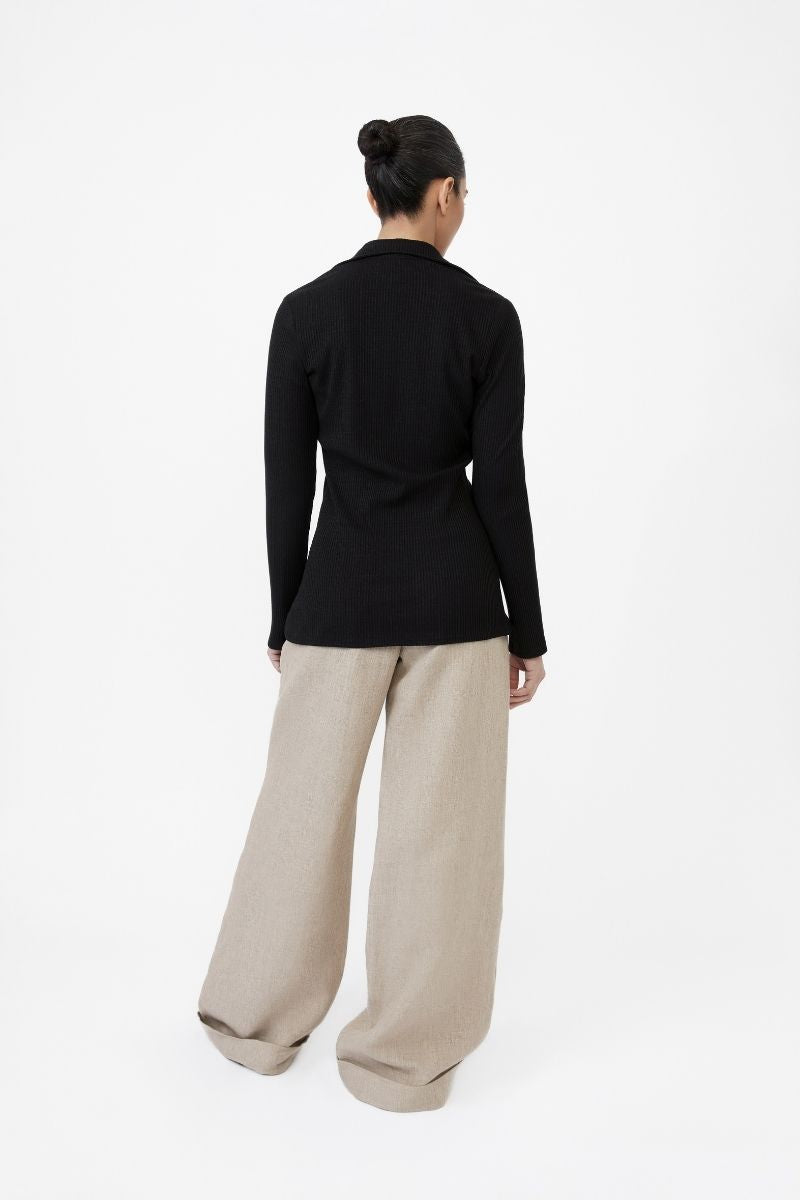 Dāl the Label modal rib knit collared cardigan featuring a soft, fitted design with a button-front and ribbed texture.
