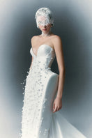 White Plan Christopher gown featuring elegant fabric and classic design, perfect for formal occasions.