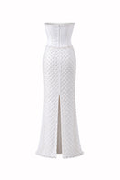 Ivory Camellia Pearl Corset Gown by HACCHIC COUTURE featuring intricate pearl embellishments and elegant satin fabric.