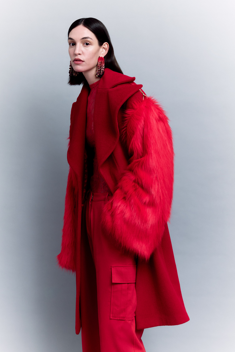 Sudi Etuz oversized coat with removable faux fur sleeves, featuring a stylish, modern design and a cozy, warm look.
