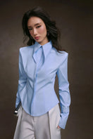 Keira Tong striped cupped collar shirt with long sleeves and button-front detail, shown on a mannequin.