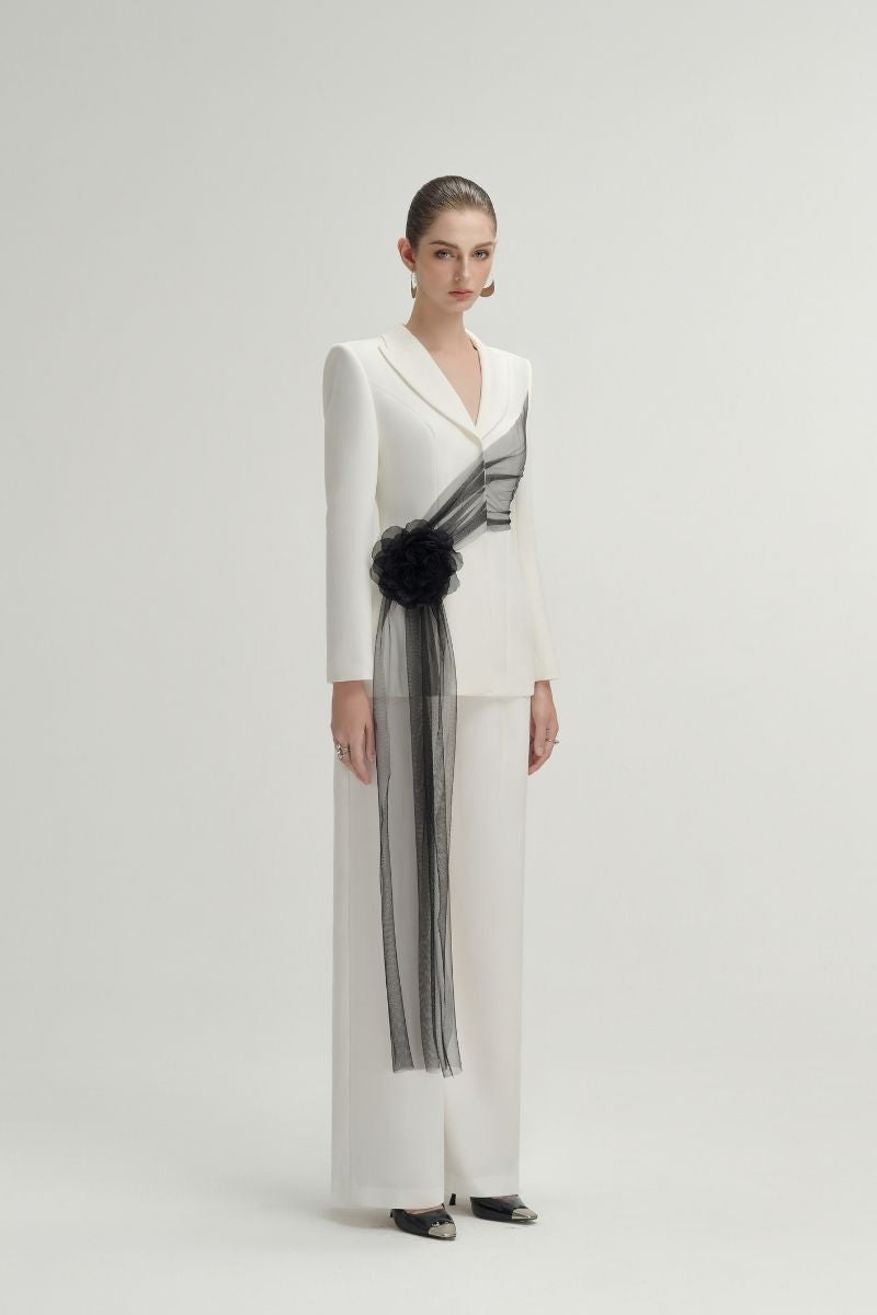 White Jane pants by Arti Apparel, stylish and comfortable pants with a relaxed fit, shown on a model.