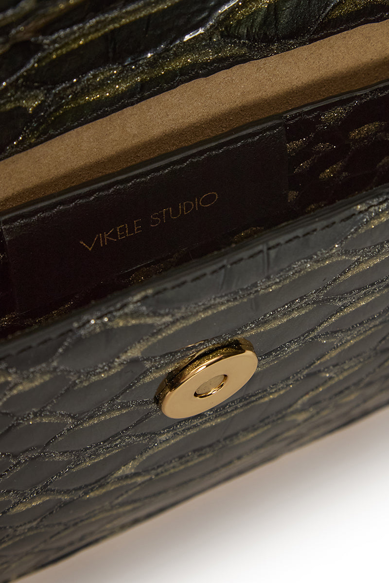 Vikele Studio Opera clutch in Python with sleek design, featuring textured snake print and elegant gold clasp detail.