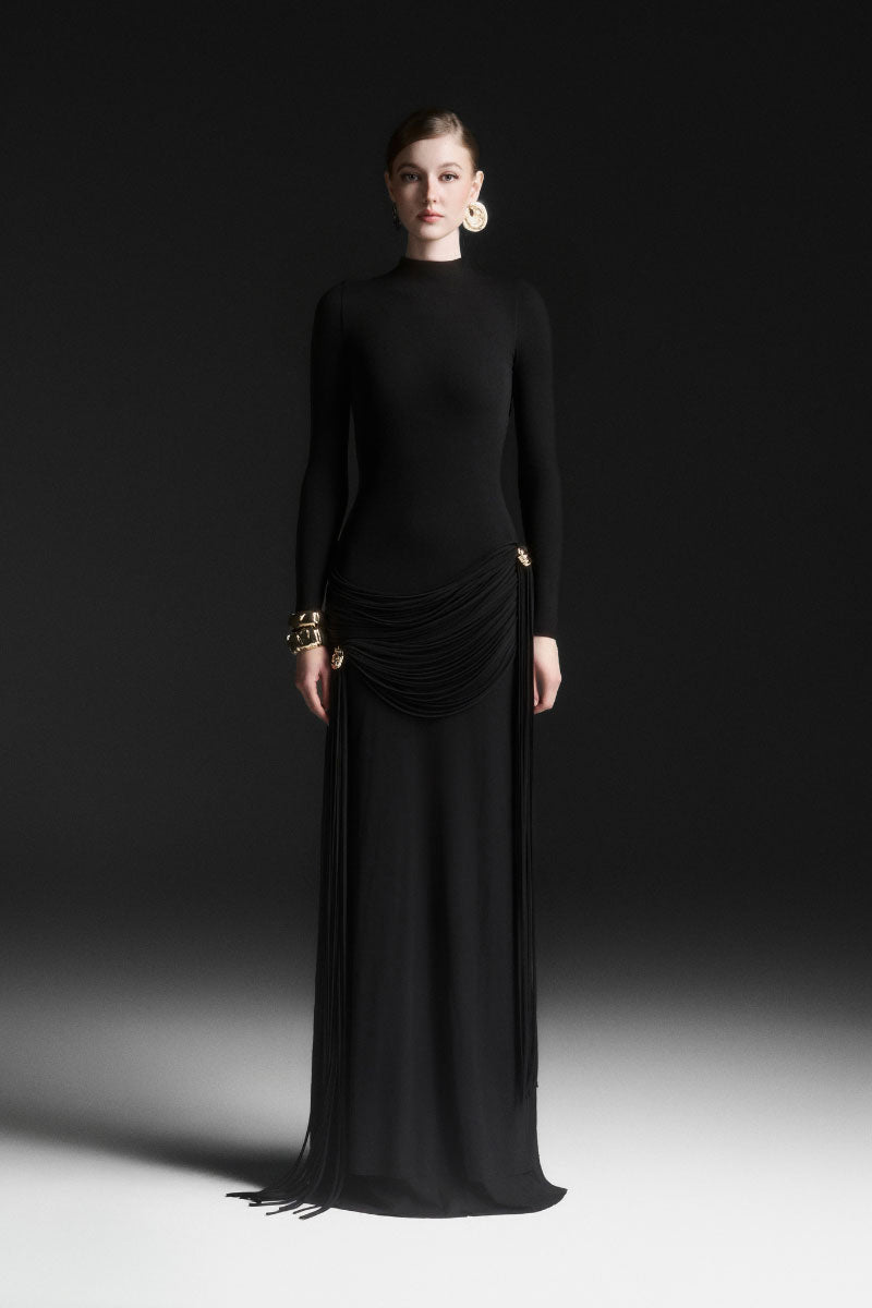 Black Maison Des Copains Miréa high neck floor-length gown with elegant design and flowing fabric on a dress form.