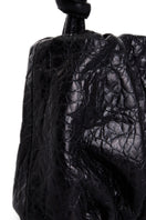 Black Rosie shoulder bag by Vikele Studio featuring a sleek design with a top handle and chain strap.
