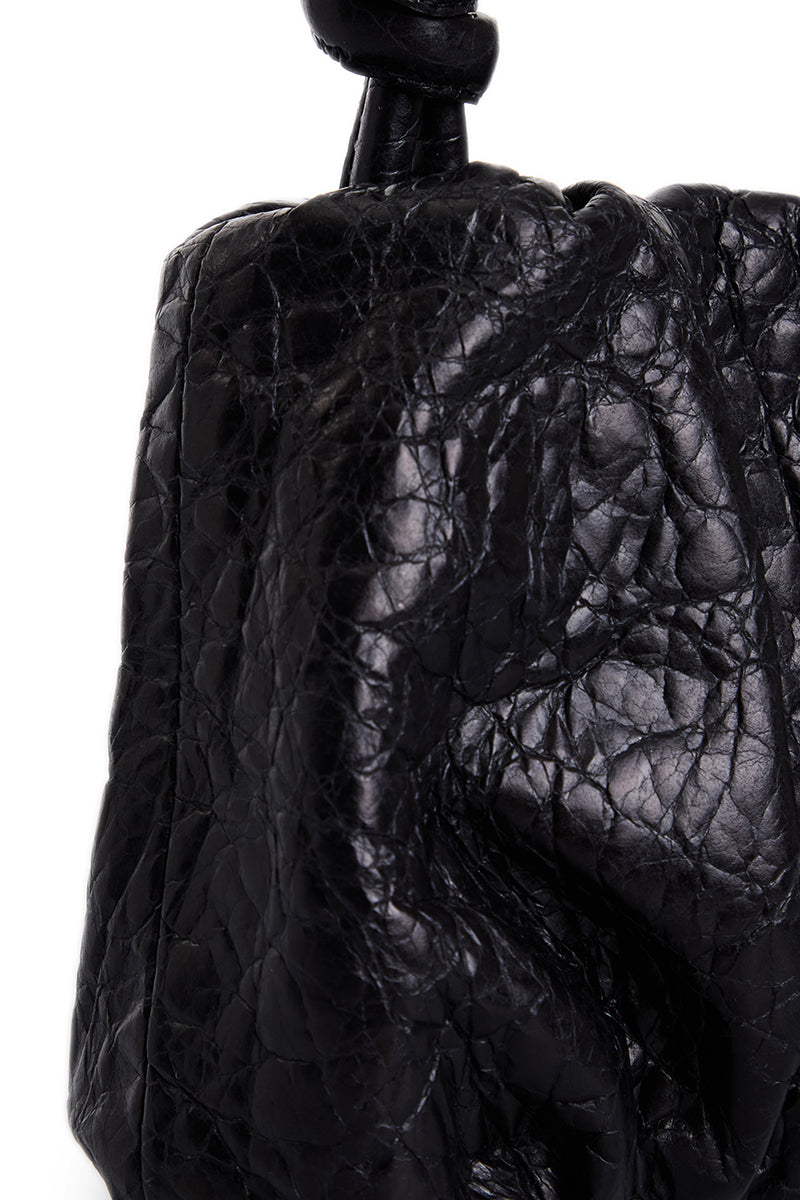 Black Rosie shoulder bag by Vikele Studio featuring a sleek design with a top handle and chain strap.