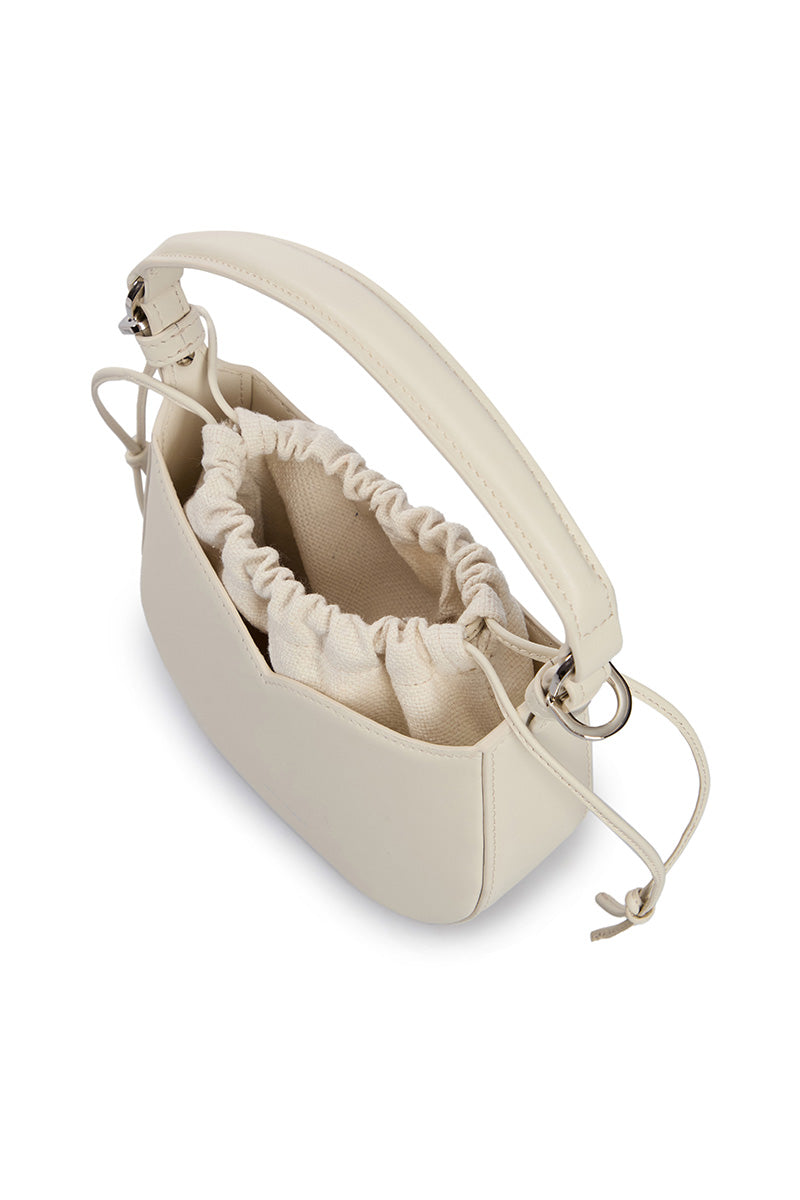 VIKELE STUDIO Maria Mini Bag in Milk, a stylish top handle bag with a soft, neutral-colored design and compact shape.