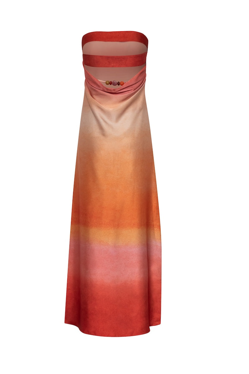 Baobab Lola maxi dress featuring a flowing design, vibrant colors, and a stylish sunset-inspired pattern.