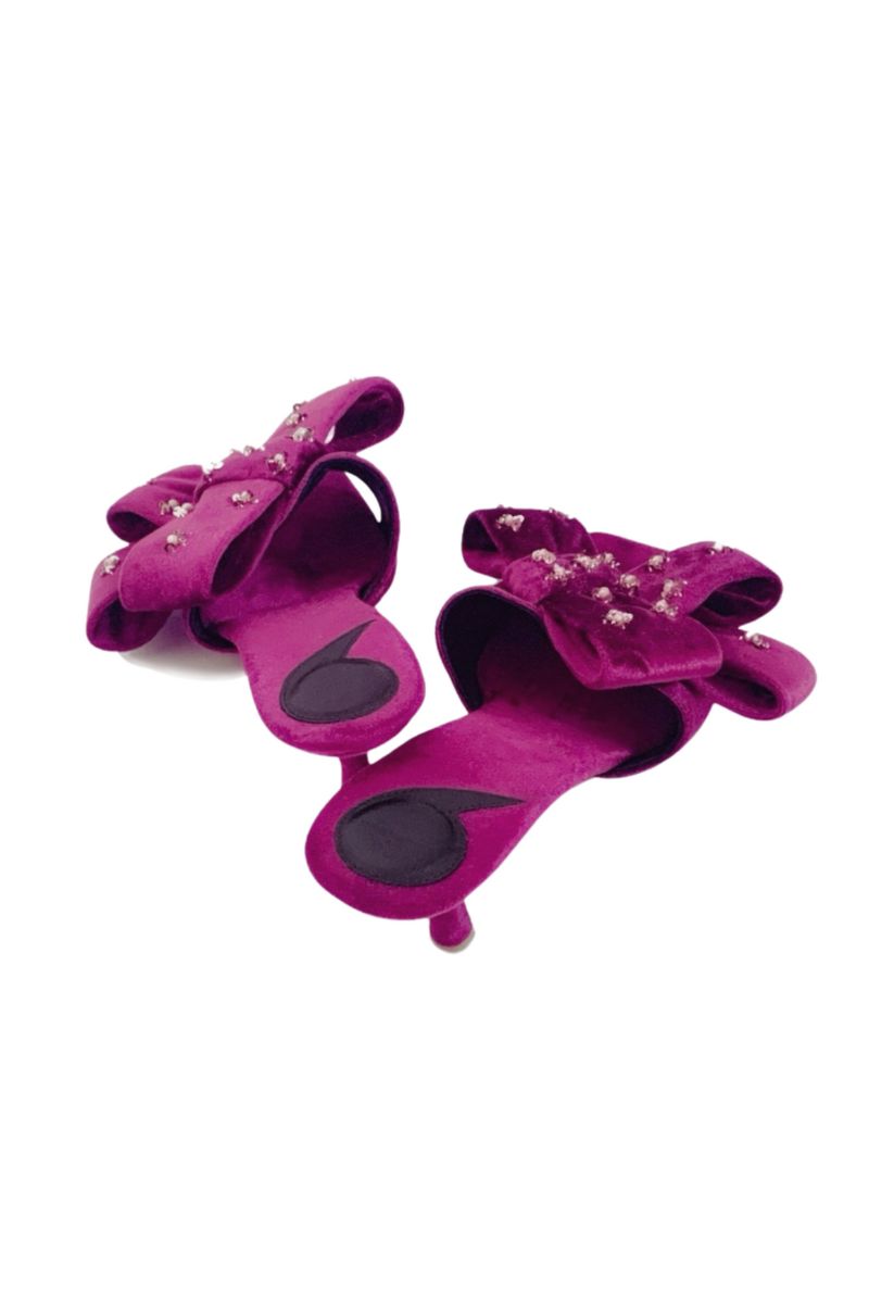 Christin Wu Raina fuchsia bow heels featuring stylish pointed toes and elegant ankle straps, perfect for dressy occasions.