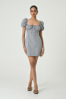Black check mini dress from Summer Away's Dominica collection, featuring a stylish, fitted design with short sleeves.