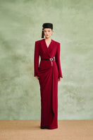 White Plan Crimson Muse gown featuring elegant red fabric and flowing design, perfect for formal occasions.