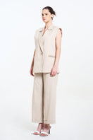 Aidan & Ice Caleste blazer in cream, tailored blazer with lapels and button closure, displayed on a hanger.