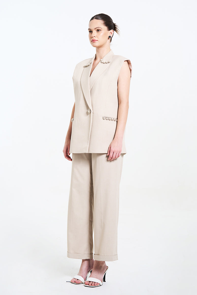 Aidan & Ice Caleste blazer in cream, tailored blazer with lapels and button closure, displayed on a hanger.