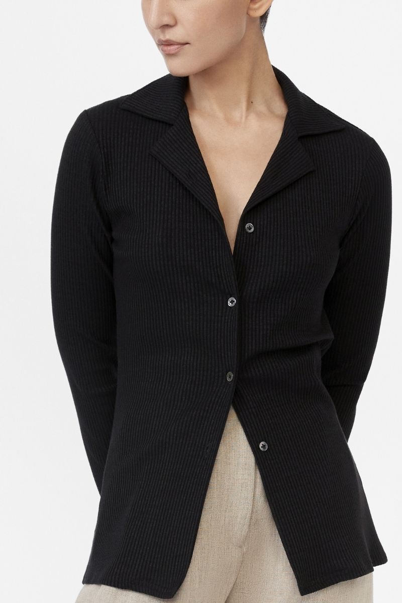 Dāl the Label modal rib knit collared cardigan displayed on a hanger, featuring a soft texture and button closure.