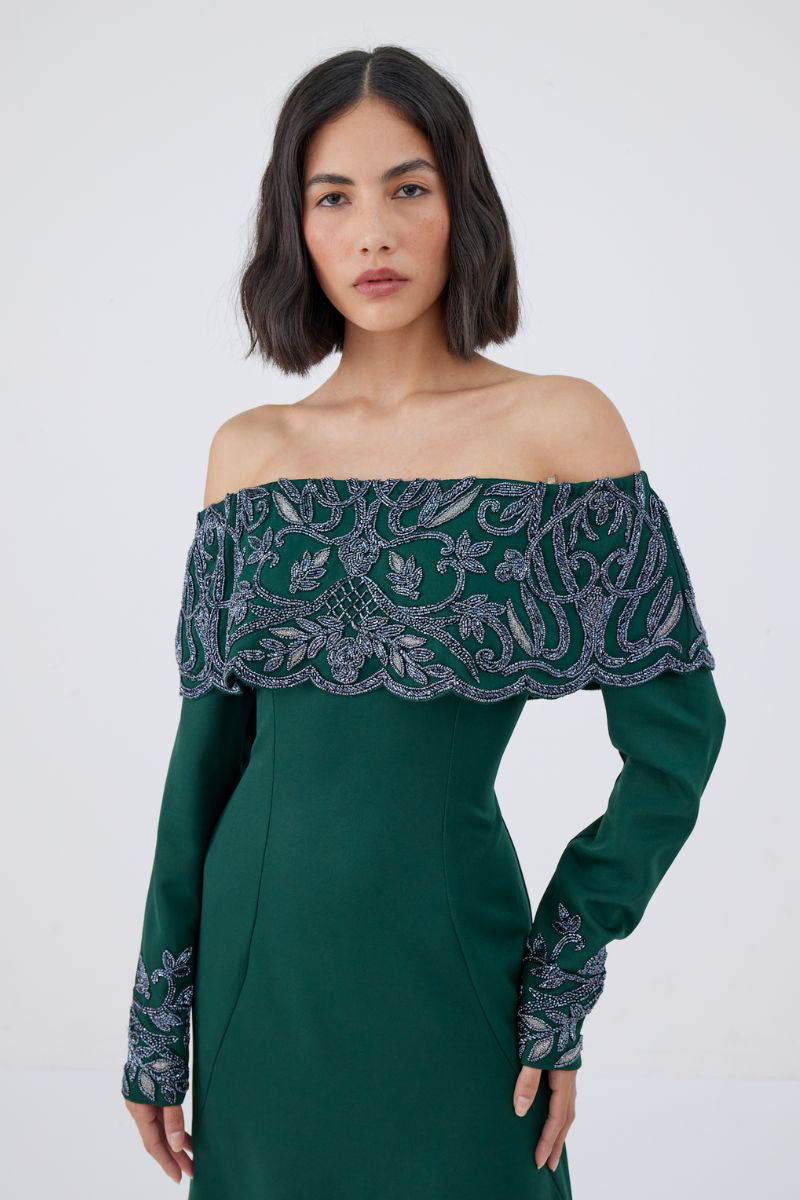 Raishma Maria Green Gown featuring flowing fabric, elegant design, and detailed craftsmanship, perfect for formal occasions.