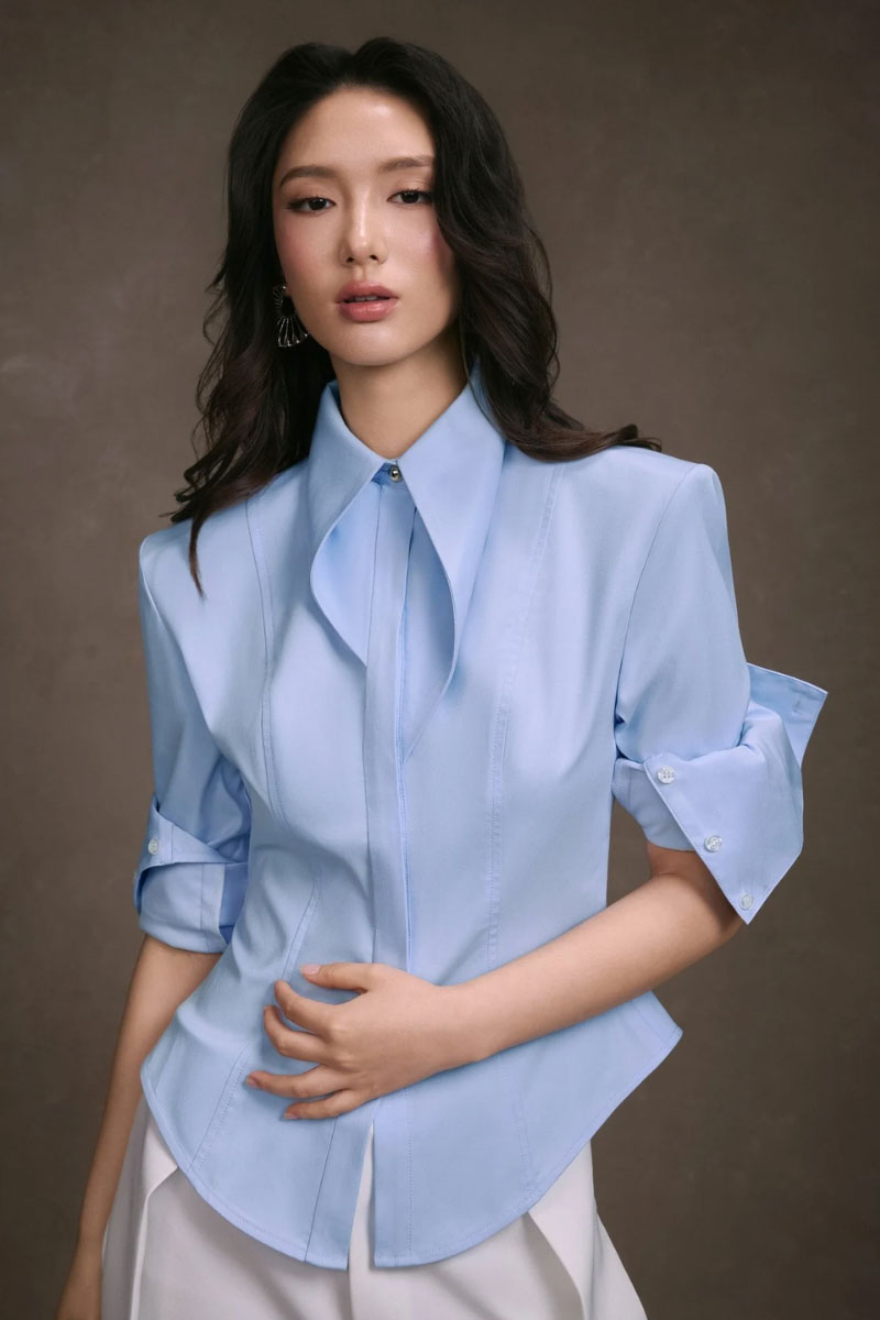 Light blue stripe cupped collar shirt by KEIRA TONG, featuring a classic button-up design and soft fabric.
