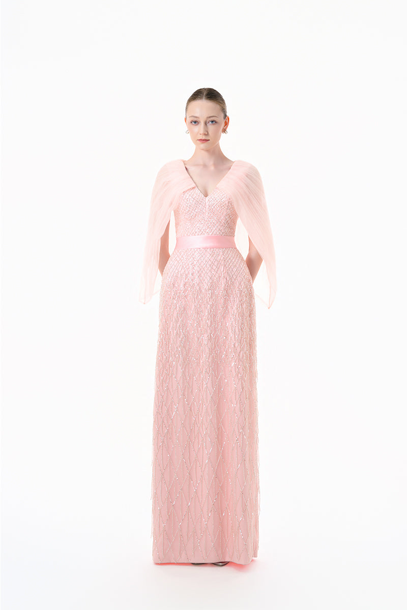 Blush pink beaded V-neck cape gown by Happy Clothing, elegant evening dress with intricate beaded details and flowing fabric.
