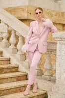 Baby pink Kelly Taffeta feather suit co-ords set by 21Six, featuring a jacket and matching pants with feather details.