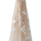 Elegant NUDE 3D-floral tulle gown by DOC BAN featuring intricate floral embroidery and flowing fabric.