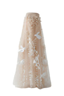 Elegant NUDE 3D-floral tulle gown by DOC BAN featuring intricate floral embroidery and flowing fabric.