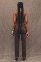 Dark brown denim tank top by TT Studios featuring a sleeveless design and casual fit, displayed on a plain background.
