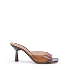 Kolane Greta mule sandals in chocolate brown with transparent straps, featuring a stylish open-toe design and comfortable flat sole.