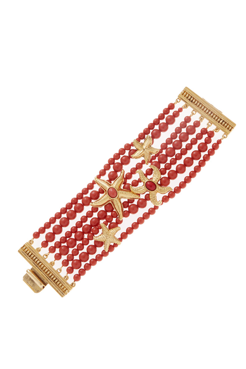Ben Amun Tory bracelet featuring layered gold-toned chains and intricate design, styled on a model's wrist.