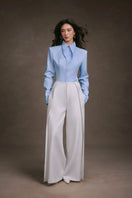 Keira Tong striped cupped collar shirt with long sleeves and button front, displayed on a hanger.
