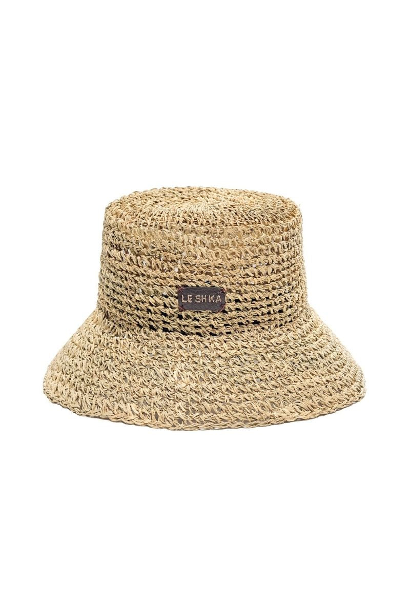 Le SH KA straw bucket hat from the VOL2 collection, featuring a wide brim and woven straw material, perfect for sun protection.