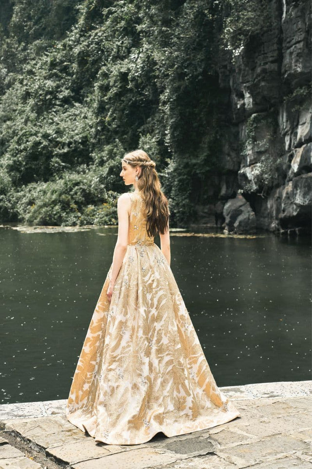 GOLDEN SLEEVELESS DEEP V-NECK GOWN | CULT MIA | Tracy Studio