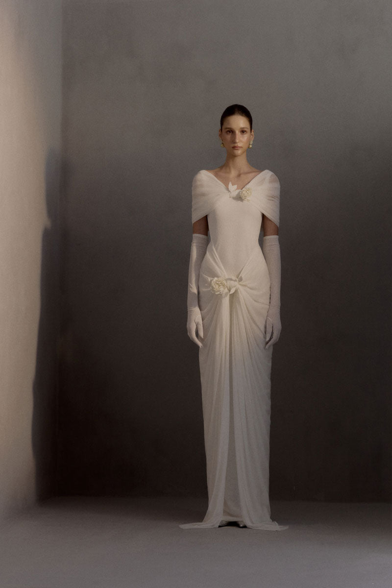 White Plan Francesca gown featuring elegant fabric and flowing design, perfect for formal occasions.