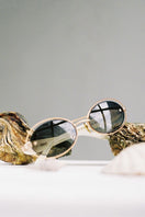 Moy Atelier Pearl Osiris sunglasses with oval frames and pearl accents, stylish eyewear for a sophisticated look.