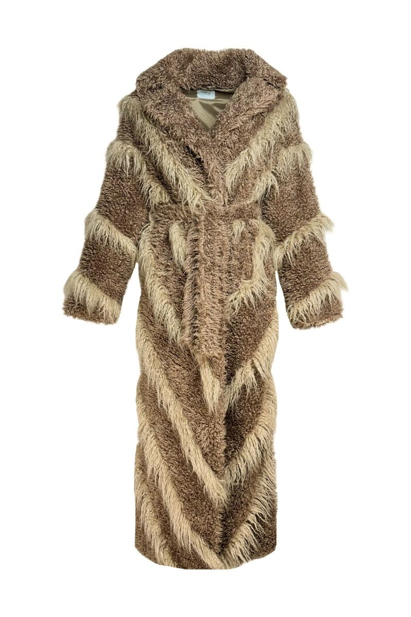 Beige faux fur maxi coat with diagonal panel design from Fortini, shown hanging with open front and plush texture.