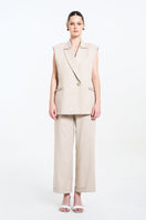 Aidan & Ice Caleste blazer in cream, tailored blazer with lapels and long sleeves, displayed on a hanger.