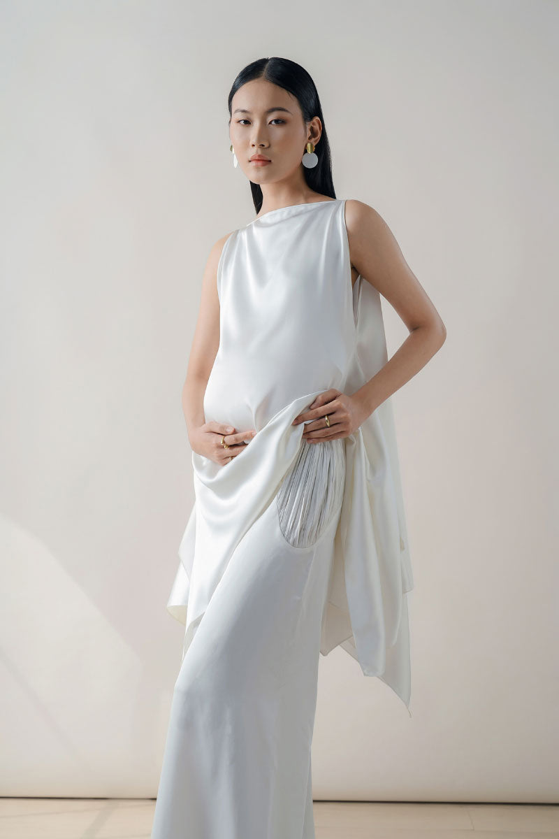 White silk tunic set by Doc Ban, featuring a midi dress with flowing fabric and elegant style.